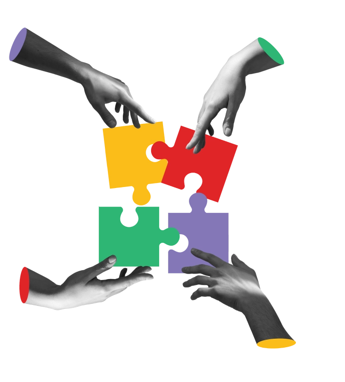 Four hands fitting together yellow, red, green and purple jigsaw pieces