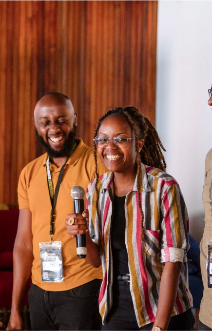 Two filmmakers sharing a microphone at a Docubox screening